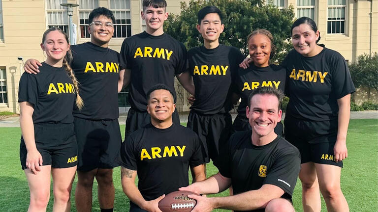 ROTC cadets holding a football