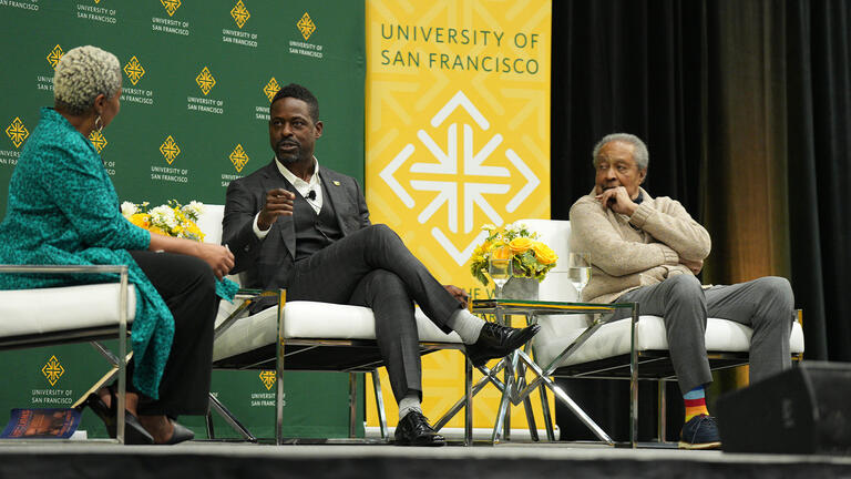 Stephanie D. Sears, Sterling K. Brown and Dr. Clarence B. Jones speak onstage