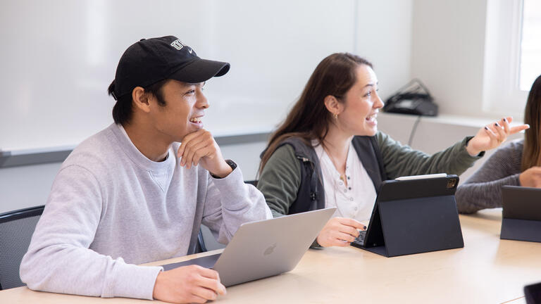 Students smiling in class.