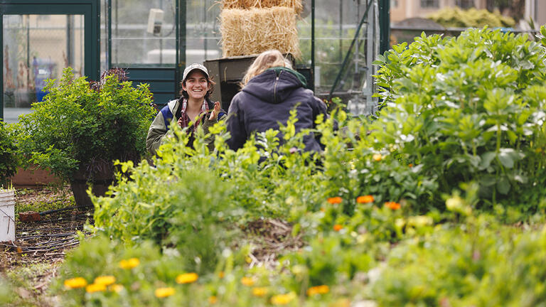 Smiling student in garden.