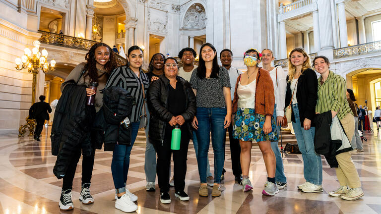 group of equity interns stand together