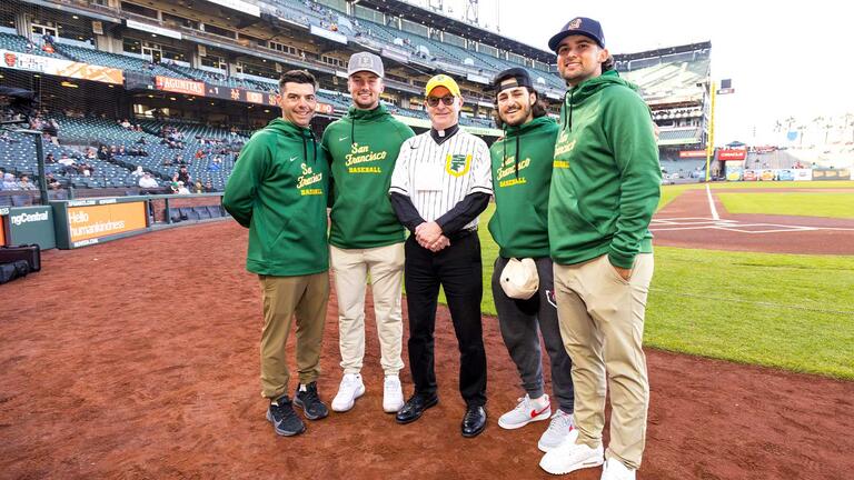 USF President Paul Fitzgerald with USF baseball team