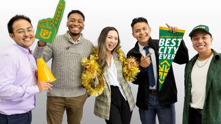 Group of USF staff smiling and posing