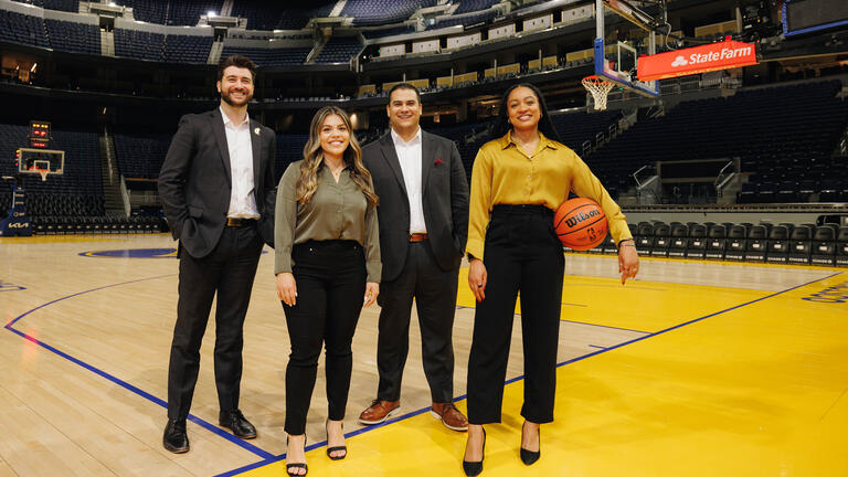 Sport Management students on basketball court.
