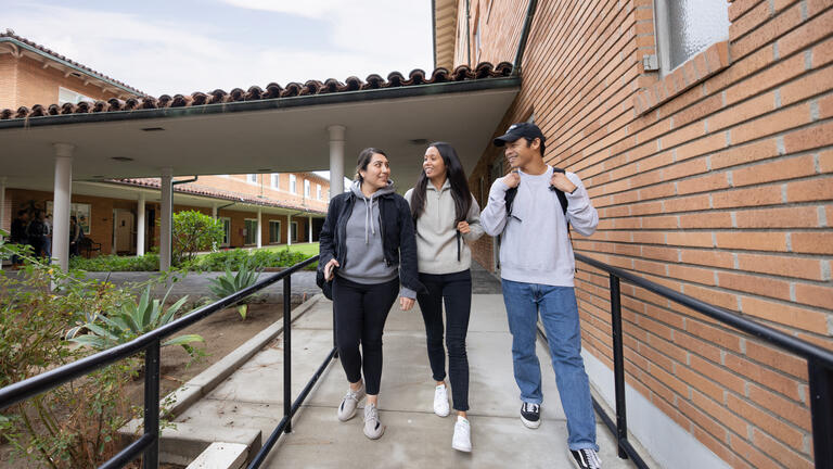 Three students walking
