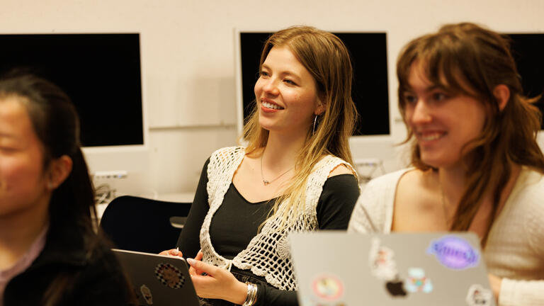 students smiling in class