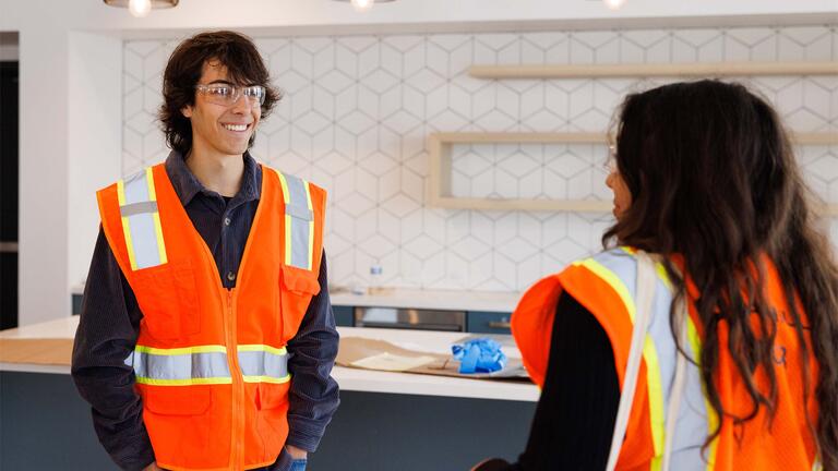 Students wearing construction vests