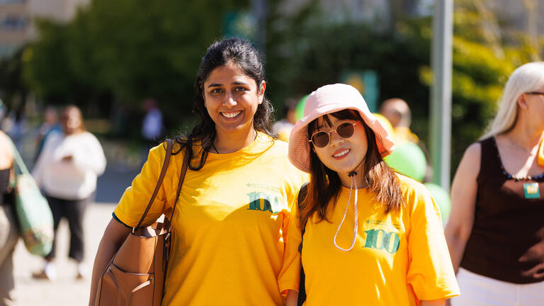 school of management students wearing centennial shirts