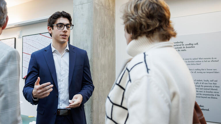 student in suit at event