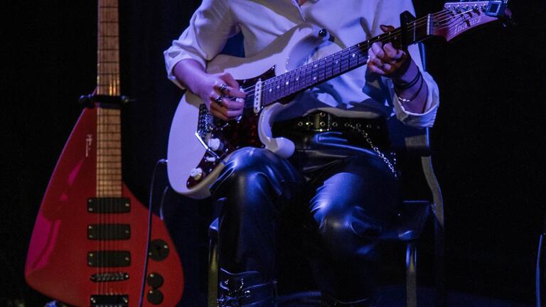 Student playing guitar