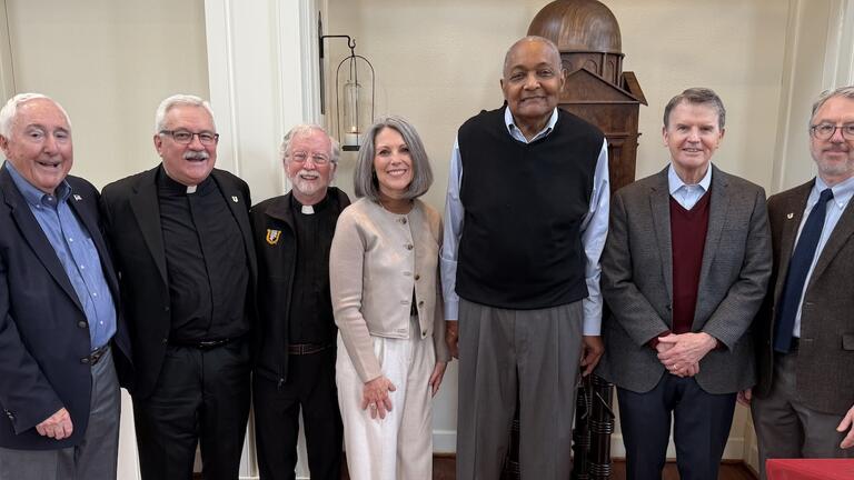 Dennis Lucey ’63, the Rev. John P. Fitzgibbons, S.J., the Rev. Bill O’Neill, Dean Eileen Fry-Bowers, Ollie Johnson ’65, Frank Butler MA ’69, and Chris Clark ’93