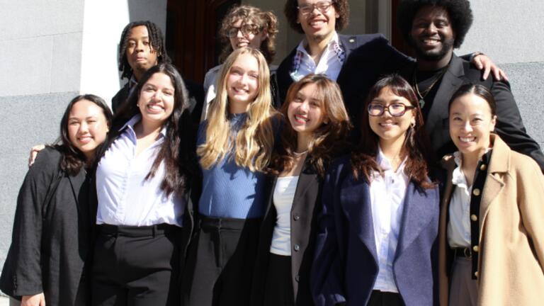 Students standing together smiling