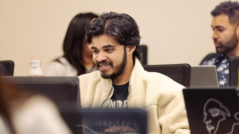 student in front of laptop