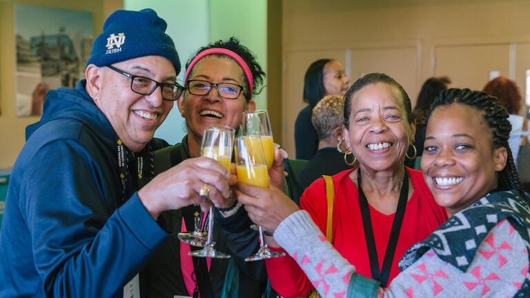 Photo of alumni toasting in celebration of Alumni &amp;amp; Family Weekend