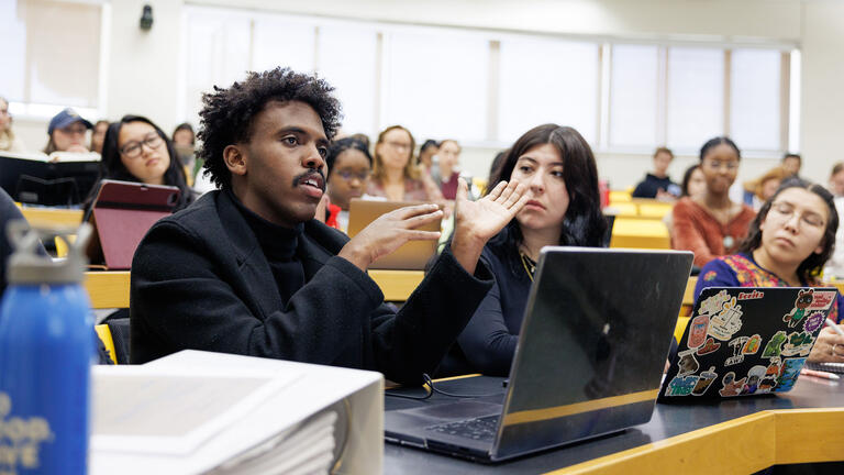 Student in lecture hall speaking