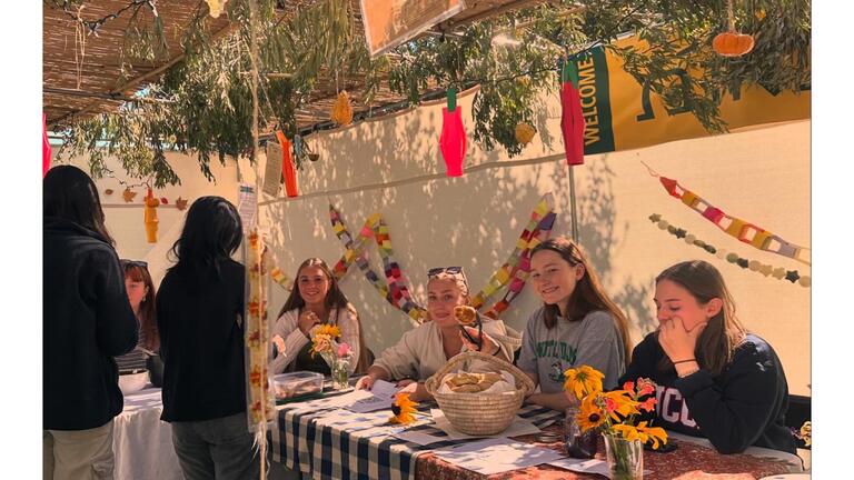 Students serving food made from USF's community garden