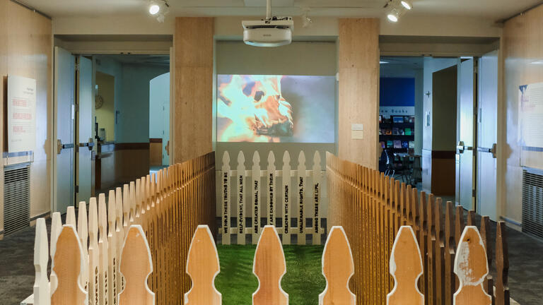 Installation image of What the world needs now is…with artworks These Truths and Pleasure to Burn.