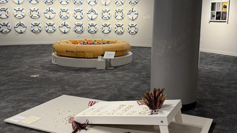 Installation image of What the world needs now is…with artworks American Pasttime, What the world needs now is…. , Life Support, and The View from Here. (front to back, clockwise)