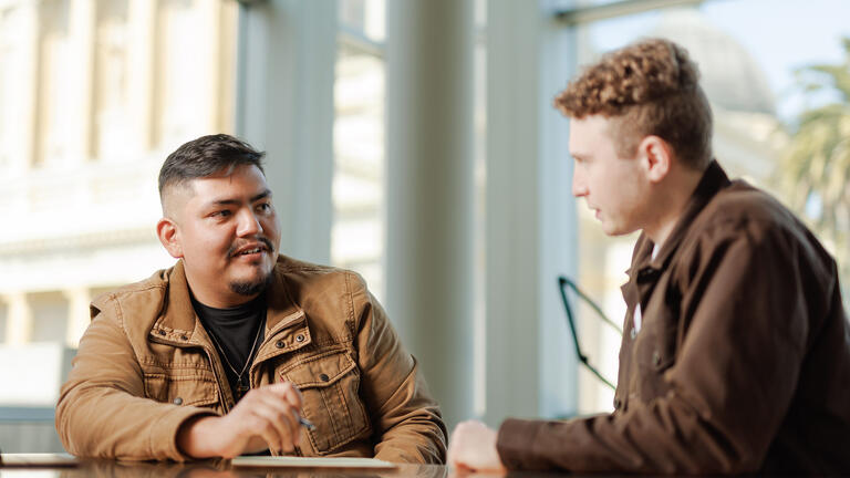 two students talking to eachother