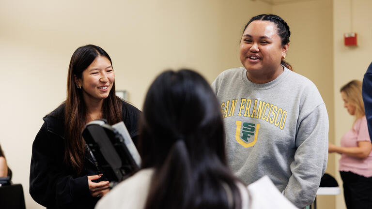 Students talking during the Health Promotion Services Annual Health Fair