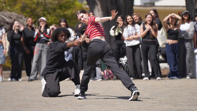students dancing at Gleeson Plaza