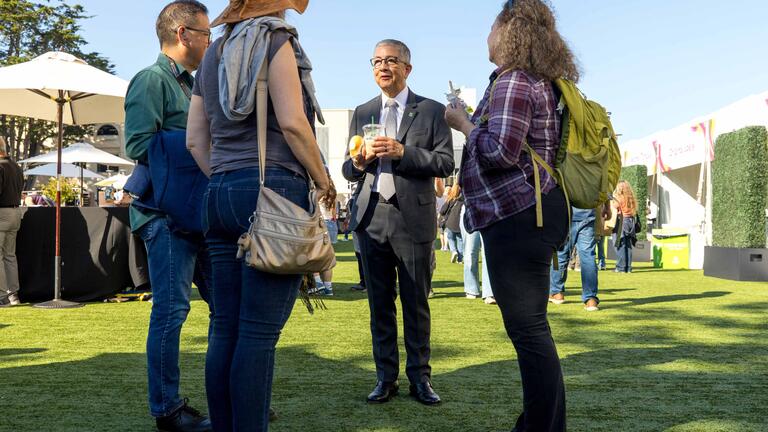 President Salvador Aceves chats with CelebrateUSF guests