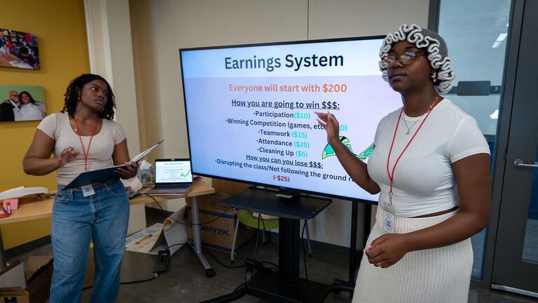 Two students teaching in a classroom