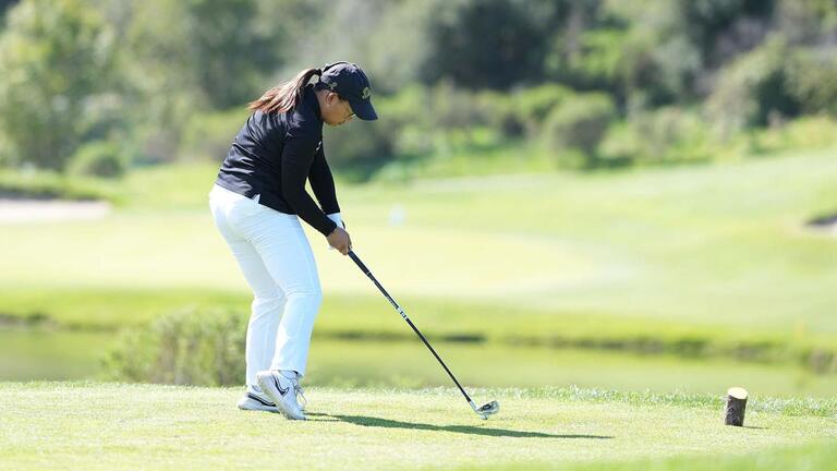 Golfer hits a drive