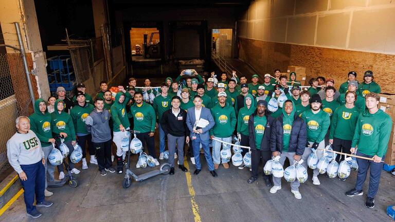 Ariel group shot of USF students and volunteers during their efforts for the food drive
