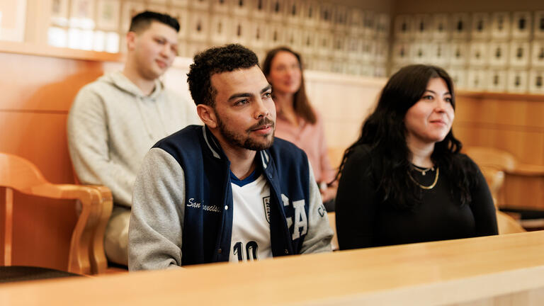 Law students listening in on a lecture