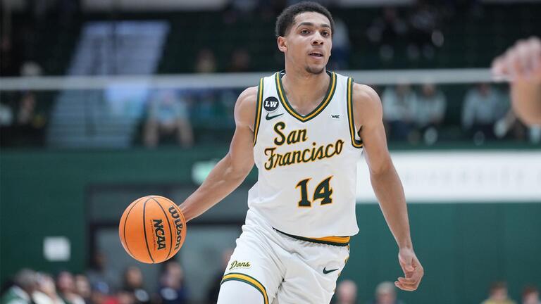 USF men&#039;s basketball player dribbling