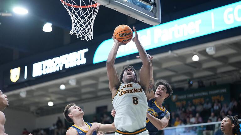 USF men&#039;s basketball player shooting a hoop