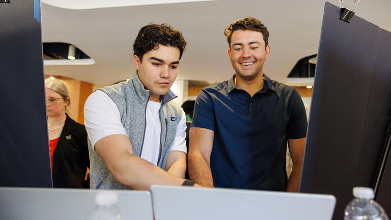Students working on computer.