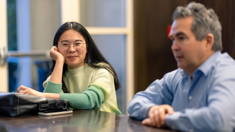 students sitting at a table in class