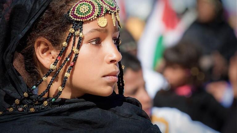 young sahrawi child with traditional headdress