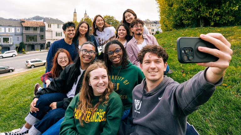Group of students take a selfie on Lone Mountain