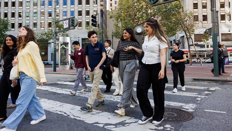 Group of students crossing street in Financial District