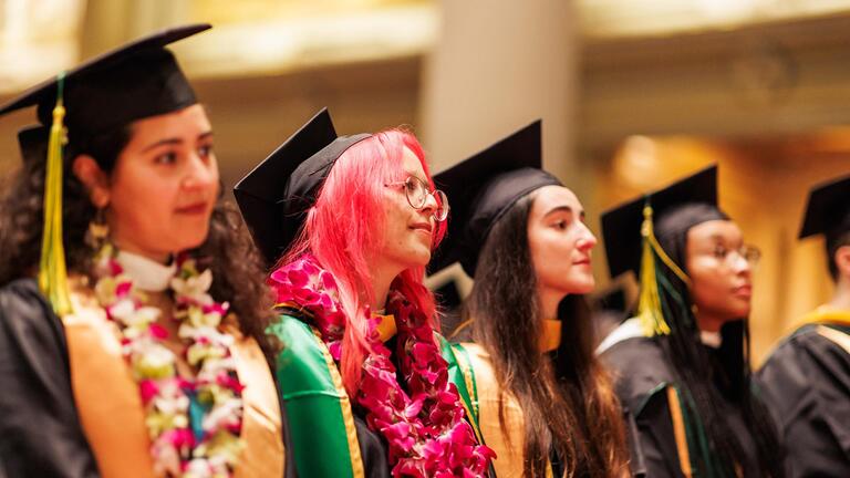 students attend graduation ceremony in st.ignatius church