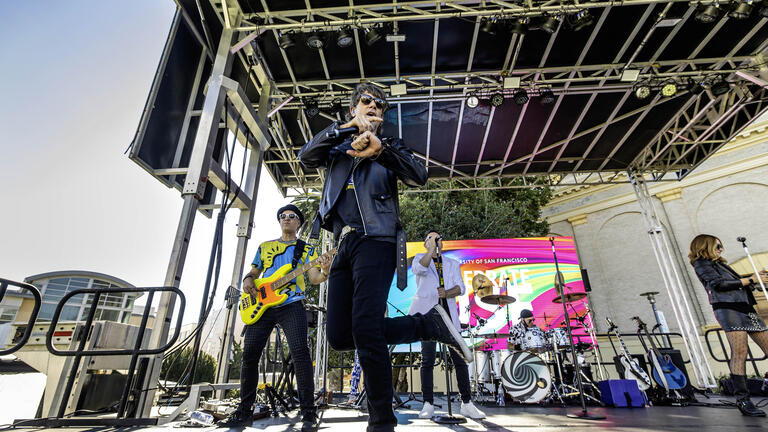 Musicians performing on stage.