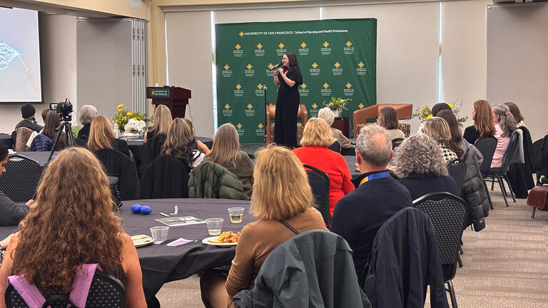 Sarah DiGregorio speaks during event