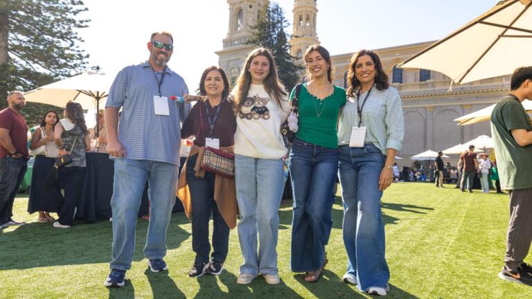 Students and family members smiling.