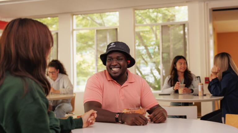 Group of students having conversations.