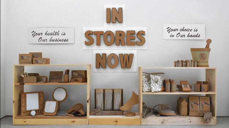 In stores now sign over shelves of pharmacy products 