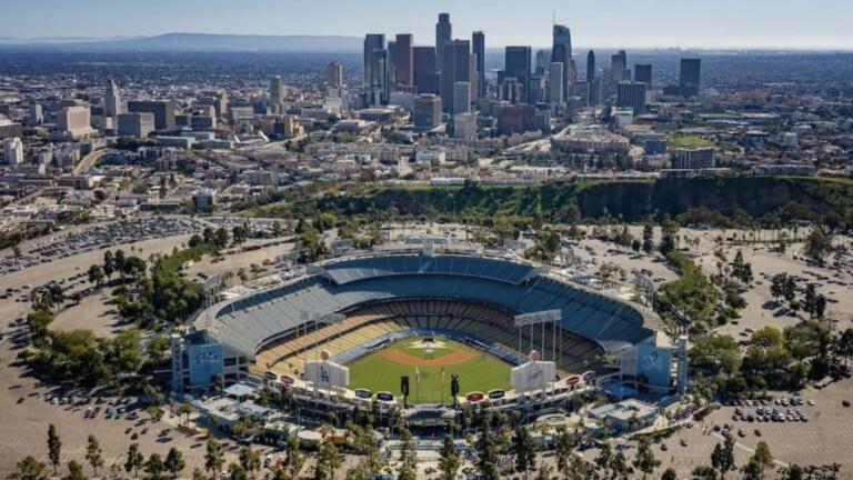 Birds eye view of the Dodgers stadium with LA skyline in the backgorund