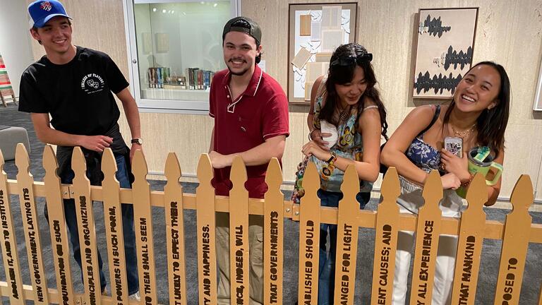 students interacting with the art installation