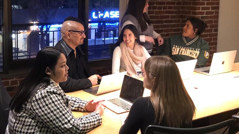 Professional communication students meeting before class