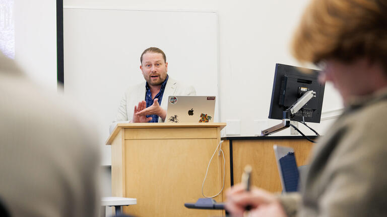 professor teaches a graduate class at usf