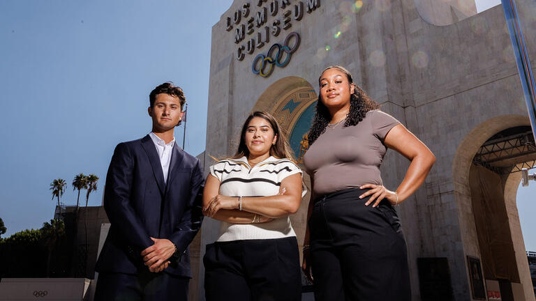 Student infront of LA Memorial Coliseum stadium