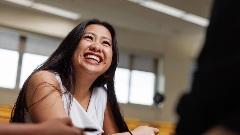 law student laughs in class
