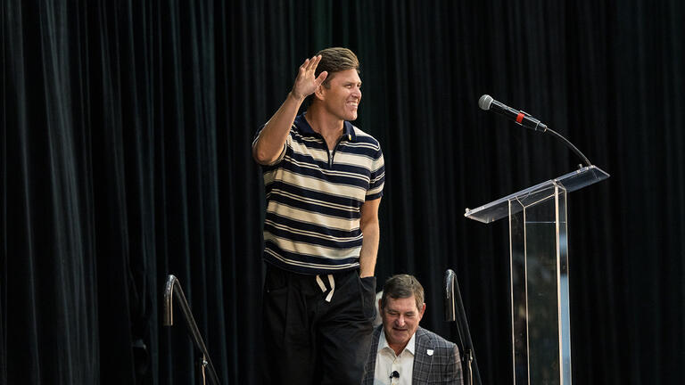 Colin Jost making his debut on the Silk Speaker Series stage and waving to the crowd